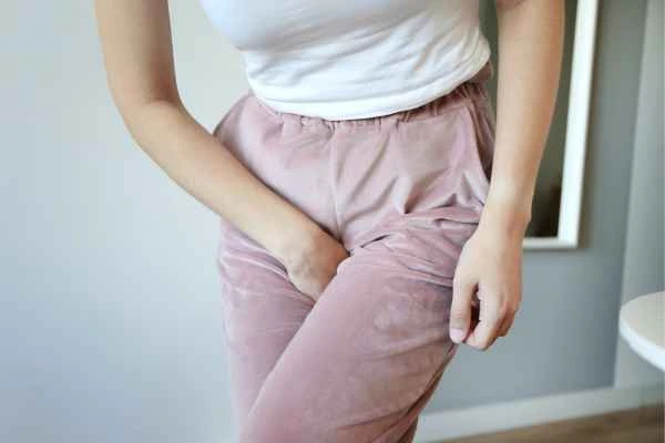 woman running for the toilet because of urinary incontinence Brackley